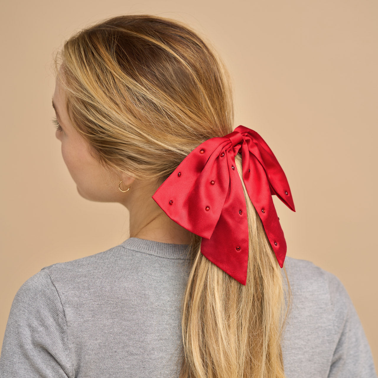 503677-Holiday-Satin_RhinestoneBowScrunchie-Red-Model-3-1280x1280px